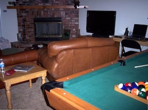 Another view of the living room with the pool table.