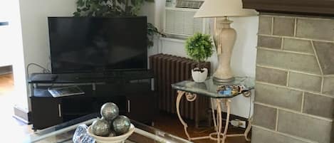 Spacious living room. View your favorite shows on a 40” flat tv. Free WiFi 