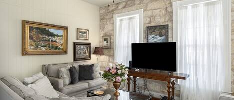 Entering the suite, guests are treated to a lovely living area