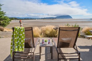 Lounge on the patio and watch the tide roll in