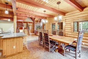 Formal dining with flexibility—extra table & chairs for full-group meals.