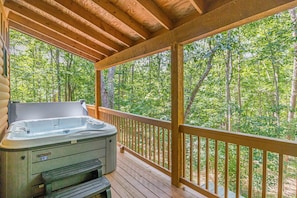 Covered Hot Tub Overlooking Lush Wooded View