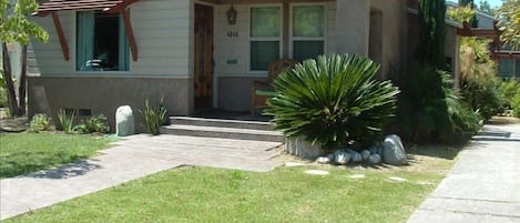 Grass lawn, shaded front porch