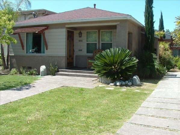 Grass lawn, shaded front porch