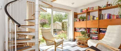 Sun room over looking south facing garden. Lots of books and board games