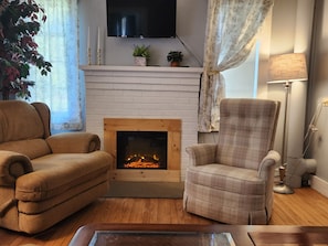 Enjoy a quiet evening by the electric fireplace