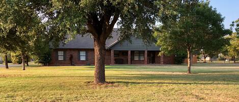 Our peaceful home. Lots of large trees and a great front porch 