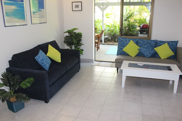 Quiet , cool comfort in the fully airconditioned Lounge, with patio access 