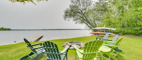 Carp Lake Vacation Rental | 2BR | 1BA | 4 Steps for Entry | 550 Sq Ft