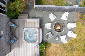 View of the back deck, hot tub and firepit!