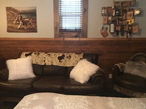 leather couch in Grain Cottage