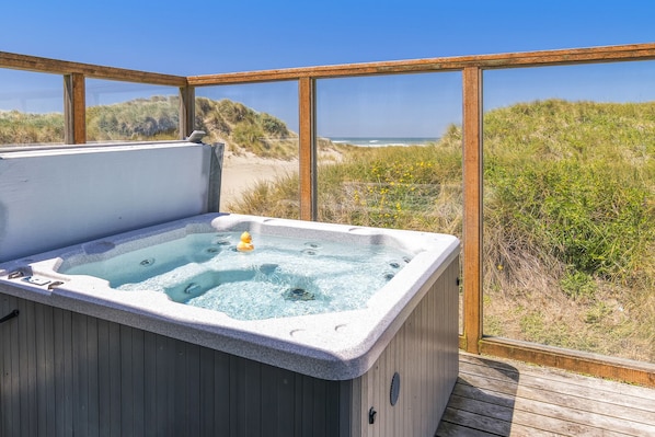 Listen to the sounds of the crashing waves from the hot tub.