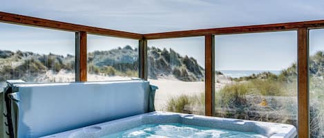 Listen to the sounds of the crashing waves from the hot tub.