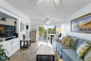 Updated Living Room with Sleeper Sofa and Balcony Access