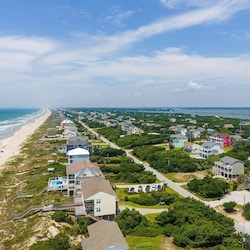 AERIAL SHOT OF THE HOUSE TO THE OCEAN