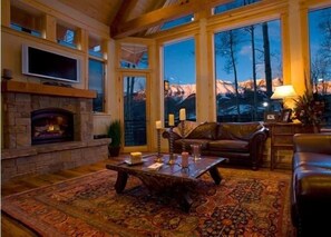 Living room with leather couches and fireplace