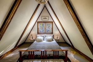 Cozy upstairs bedroom with queen bed