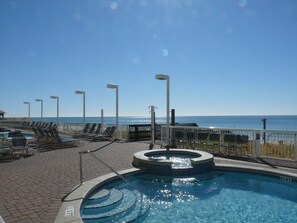 there are two swimming pools on the patio and jacuzzi too