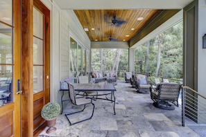 Front porch overlooks pool and faces beach 