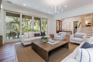 Living room with two large sofas and two lounge chairs.