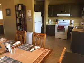 Kitchen has a full-sized refrig, stove/oven, super quiet dishwasher & microwave.