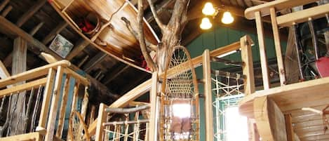 a magical loft hide-away with a tree spiral staircase