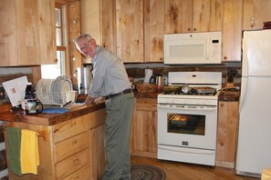 Kitchen complete with gas range and microwave