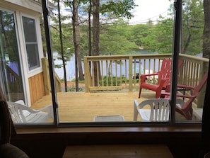 View of deck and lake from living room window.