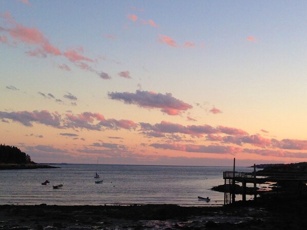 The setting sun on Lowell's Cove & the Atlantic ocean beyond.
