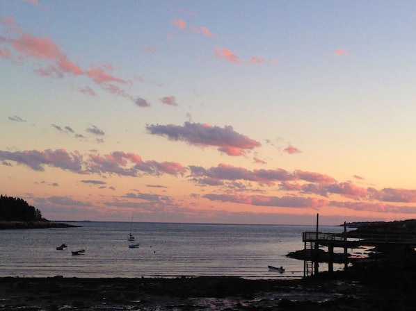 The setting sun on Lowell's Cove & the Atlantic ocean beyond.