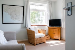 Lounge showing Ordnance Survey map of area, smart TV