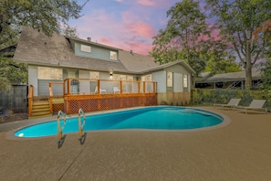 Enjoy beautiful Texas sunsets from this backyard oasis.