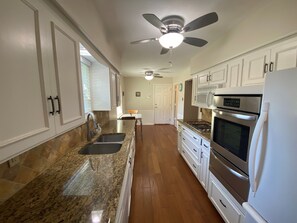 Kitchen with kitchenette/dining area 
(High chair is available for use)