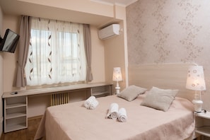 Bedroom with AC and TV