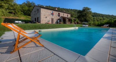   Stone Farmhouse with Pool at the Edge of a Forest 