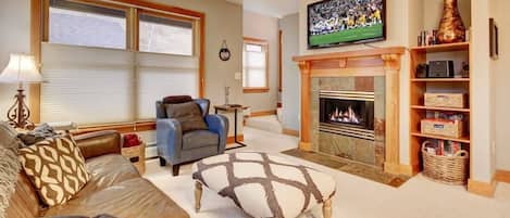 Living room - fireplace, comfortable seating, and flatscreen TV