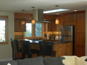 View from living room to the bar and kitchen