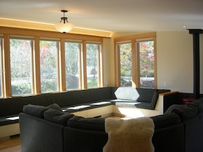 Living room looking out to peaceful park in cul de sac and dramatic mountains