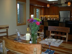 View from dining table looking toward the bar and kitchen with high end finishes