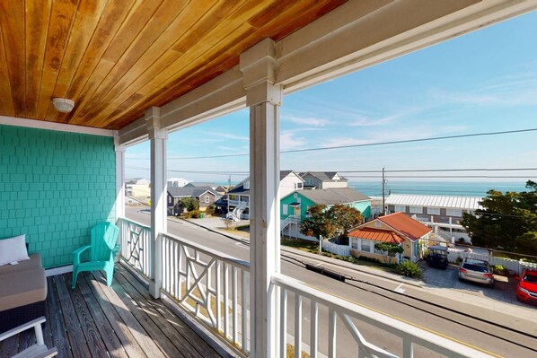 Watch the sunrise over the ocean or have a beverage after a long day at the beach from the large top deck at Pirate Queens