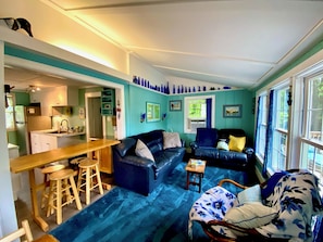 Breakfast bar with 4 stools. There is also a dining table with folding chairs