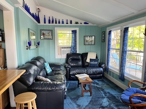 Living room looking out to the lake. Blue leather living room set.