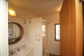 Bathroom upstairs, complete with shower over small bath perfect for children
