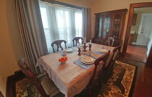 Large dining room with table that sits 6