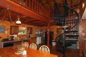 Kitchen view of spiral staircase to Loft