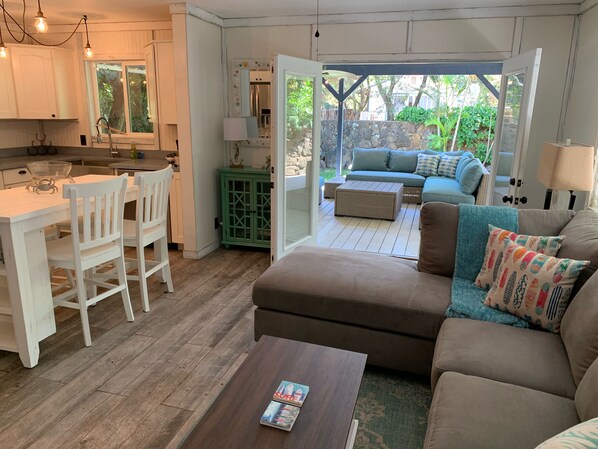 Comfortable living room and kitchen area.  With access to the large Lanai. 