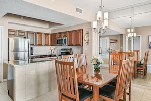 Kitchen with new granite counter top, new backsplash, and decor ceiling, light.