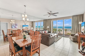 Dining area plus living area with TV.
Glass doors to the balcony.