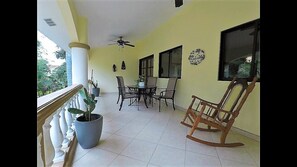 Relax on the over-sized terrace overlooking the pool