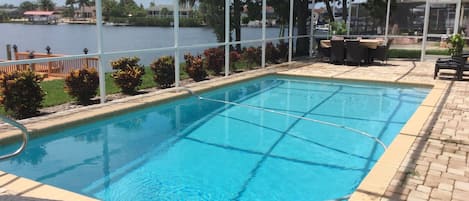 Screened-in pool area keeps you bug-free and comfortable. 